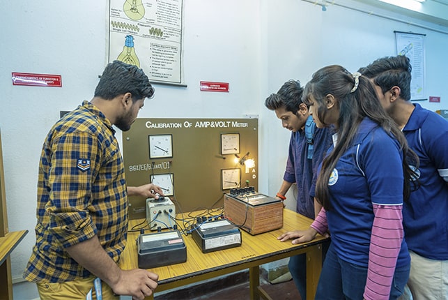 Brainware University electrical engineering students are testing in lab