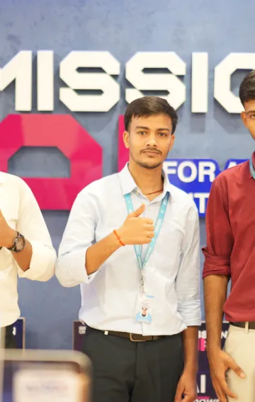 AIRDC team members in front of the Mission AI sign