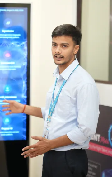 AIRDC team member presenting projects on the kiosk